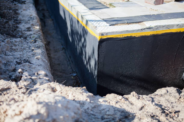 Professional Basement Waterproofing technician working in Bayville, NY